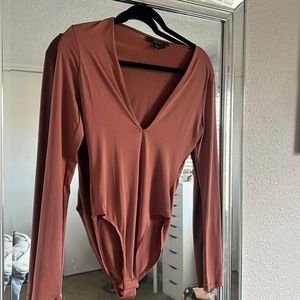 Low cut in the front body suit